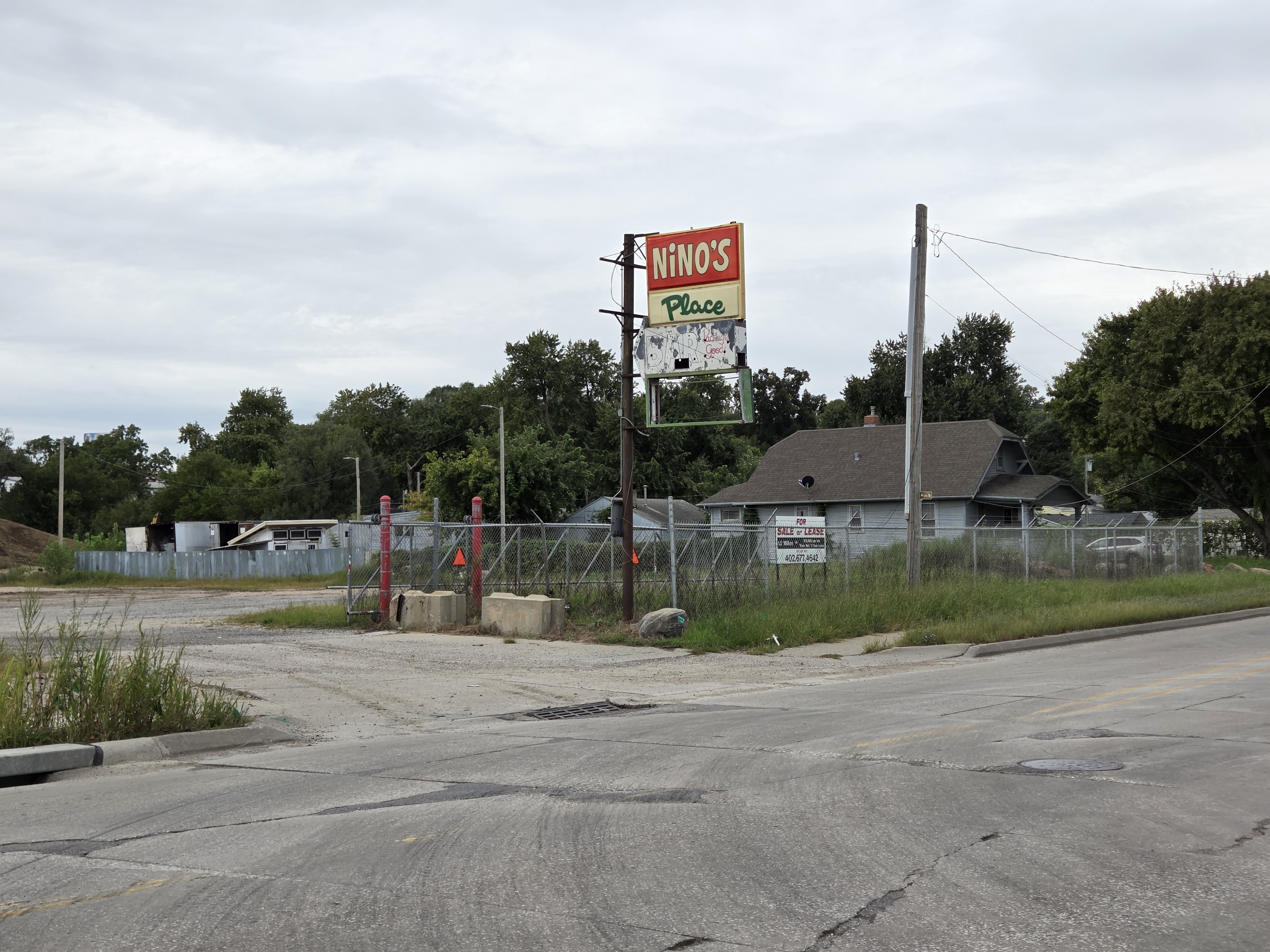 Nino’s Place: The Orphan Sign Stands in Memory of a Barman, Boxer, and Poet